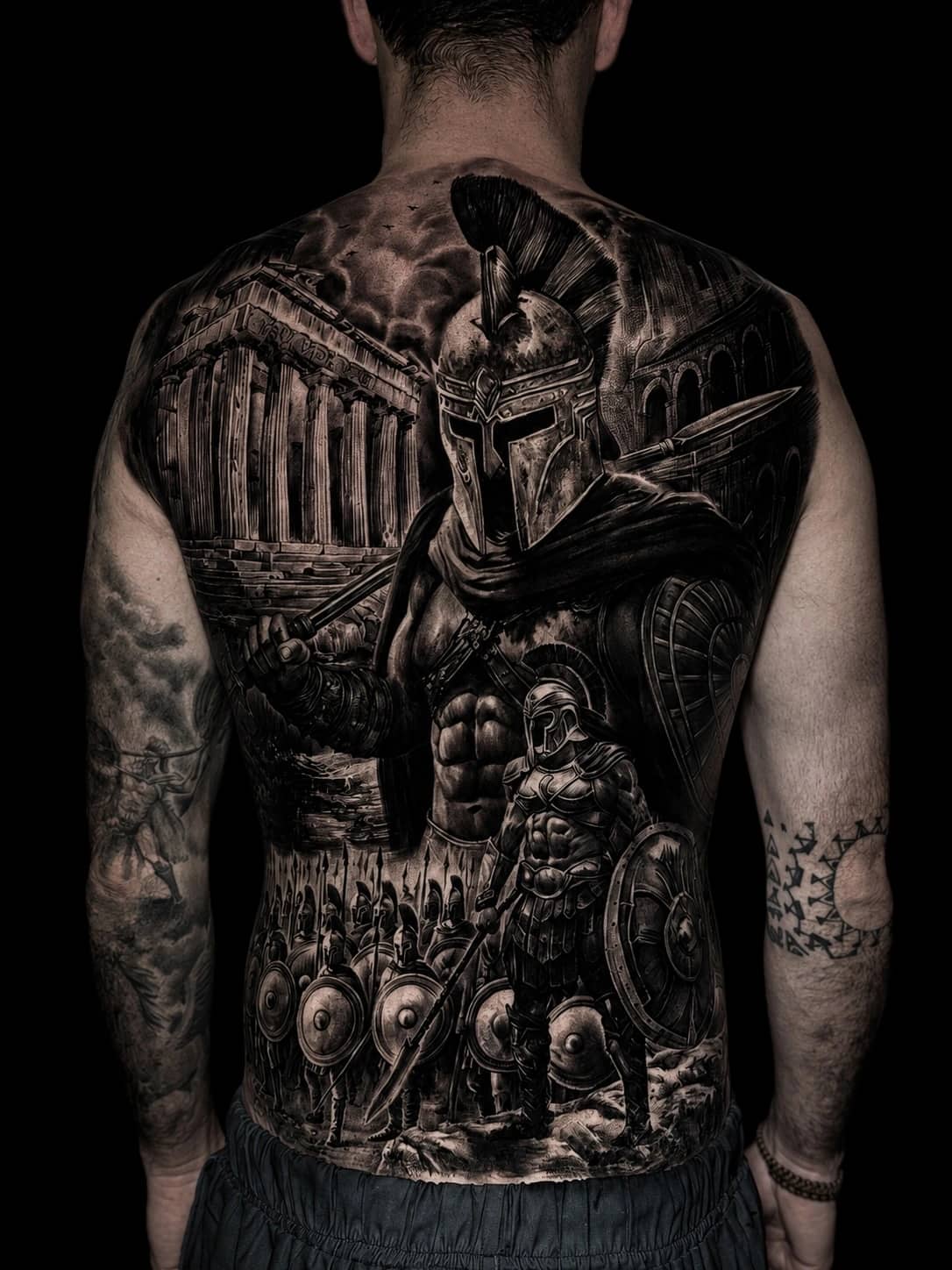 Black and grey realism sleeve with angel, skull, snake, and Greek god with lightning at Bloodline Tattoo Phuket